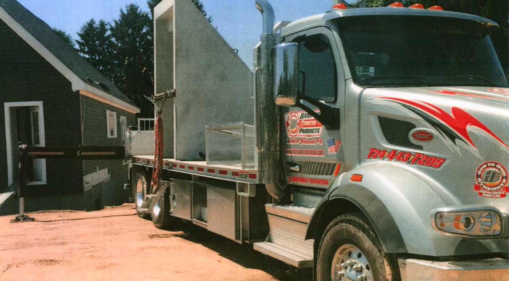 Hampton Concrete Products, Inc shipping truck being loaded infront of warehouse